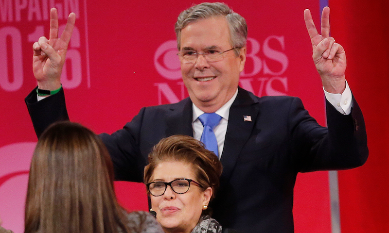 Jeb Bush throws up two peace signs after the CBS News Republican presidential debate in Greenville, S.C. on Feb. 13, 2016.